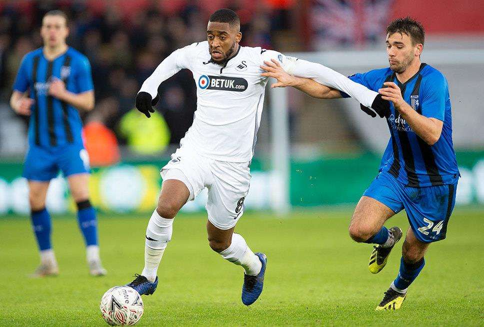 Josh Rees attempts to win the ball for Gillingham Picture: Ady Kerry