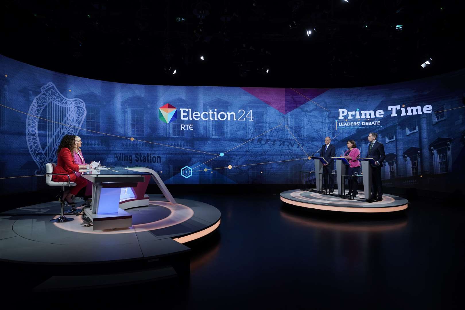 Micheal Martin, Mary Lou McDonald and Simon Harris with presenters Miriam O’Callaghan and Sarah McInerney during the final TV leaders’ debate at RTE studios in Donnybrook, Dublin (Niall Carson/PA).