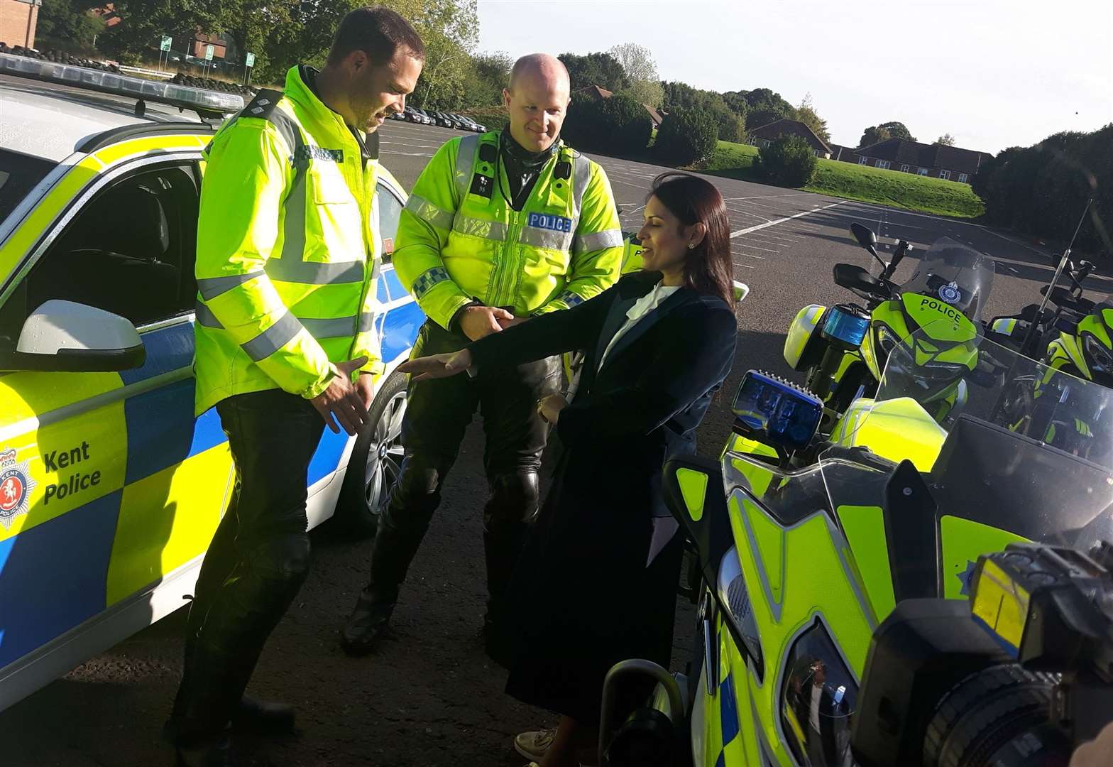 Priti patel speaks to police officers