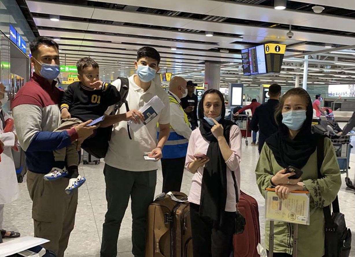 Workers for the Nowzad charity arriving in the UK from Islamabad