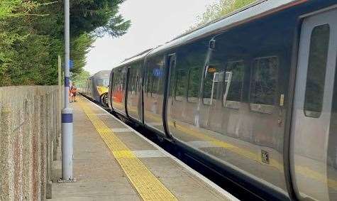 A train arrived to pull the damaged vehicle back to the depot