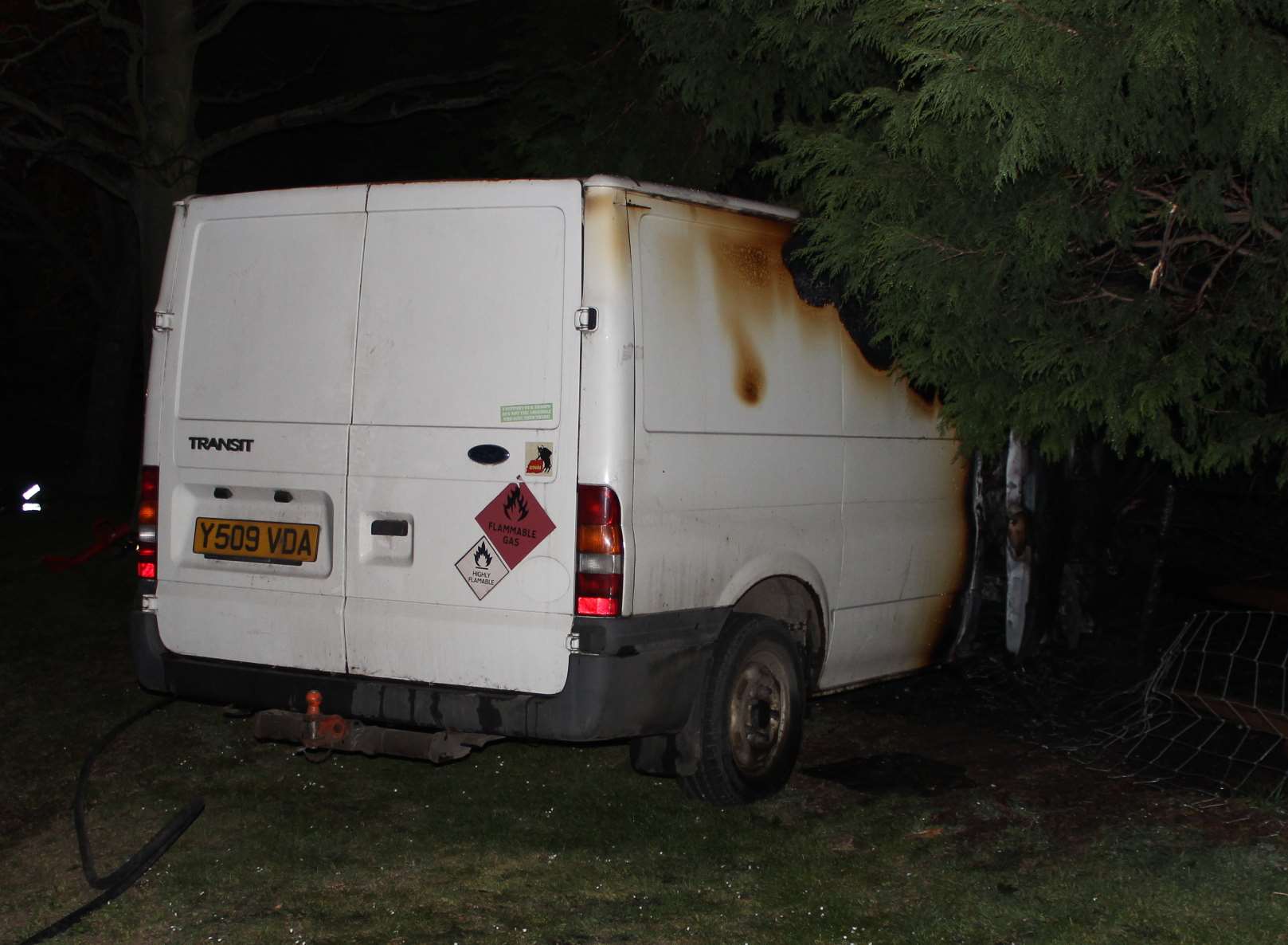 Gas warning on the back of the gutted van