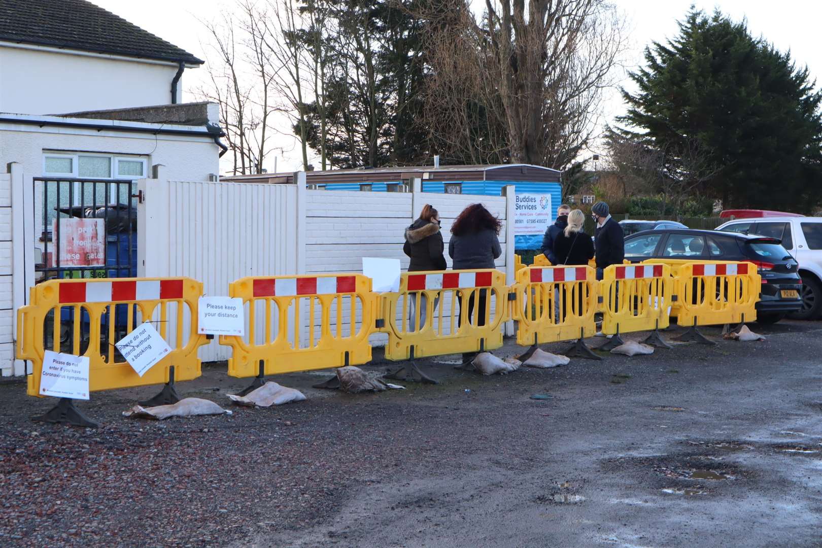 Queues outside the Sheerness East Working Men's Club coronavirus testing station at Halfway on Sheppey