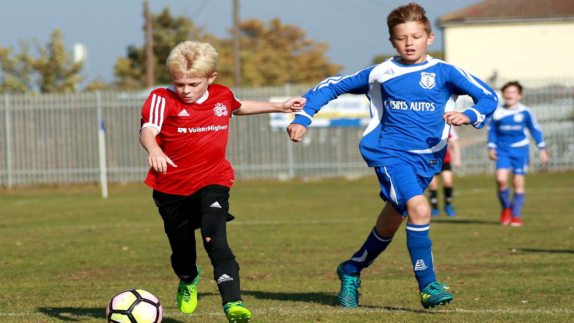 Omega under-11s on the ball against New Road under-11s Picture: Phil Lee