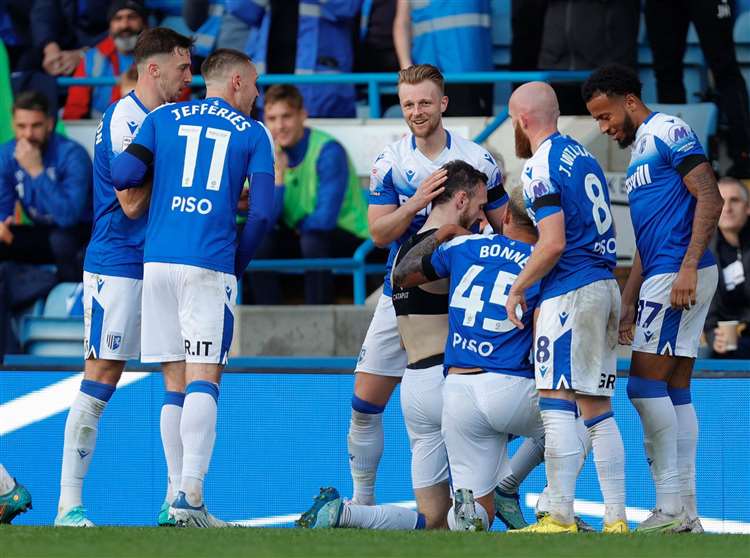 Scott Malone is congratulated by his Gillingham team-mates after scoring on Saturday but he’s a midweek doubt with a back injury Picture @Julian_KPI