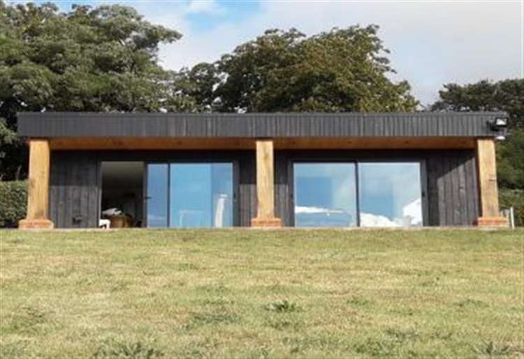 New plans have been submitted to turn the security office at Paul O'Grady's former home in Aldington, near Ashford, into a one-bed holiday let. Picture: Lambert and Foster