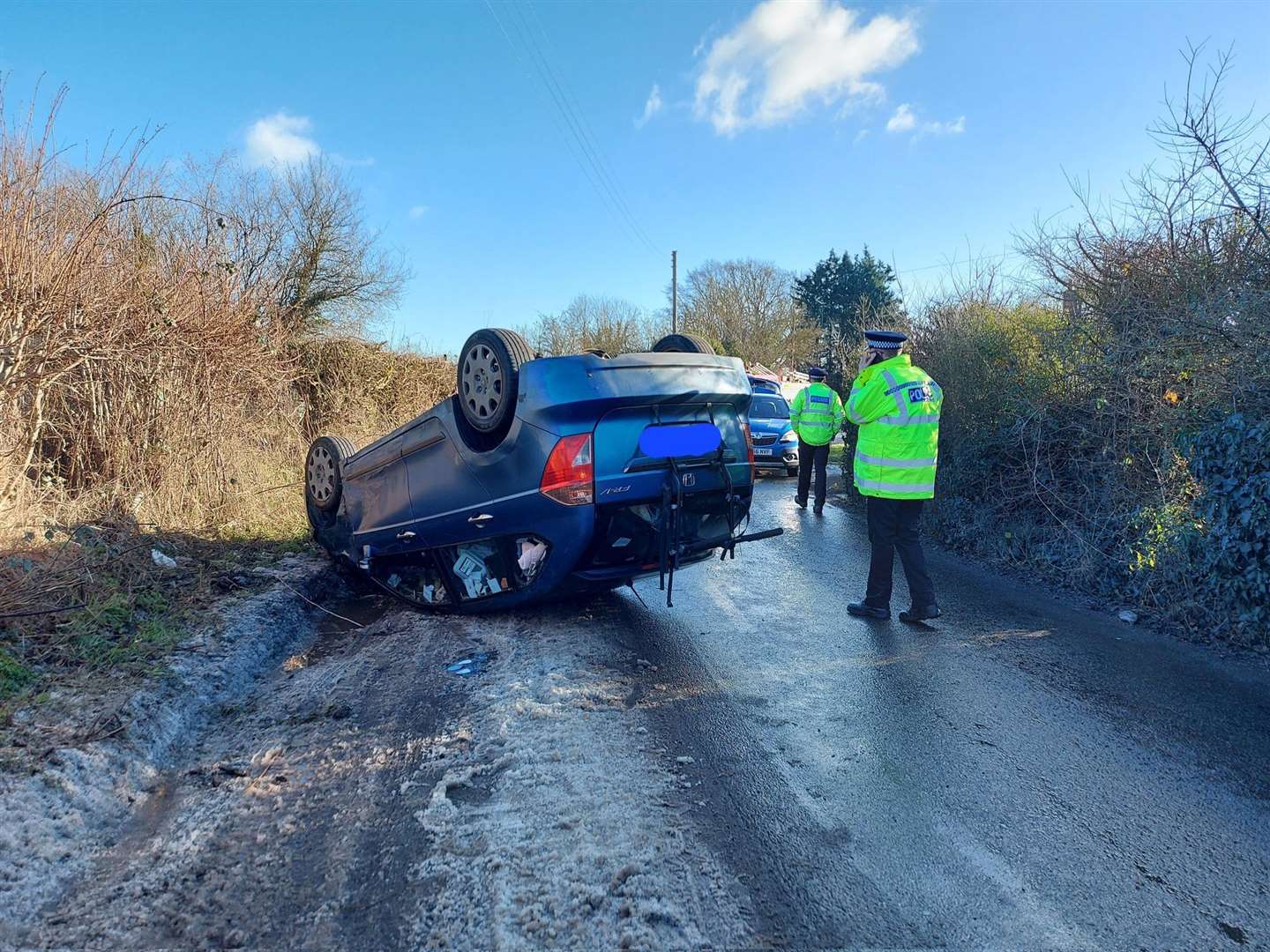 A car has overturned and blocked a road in Maidstone