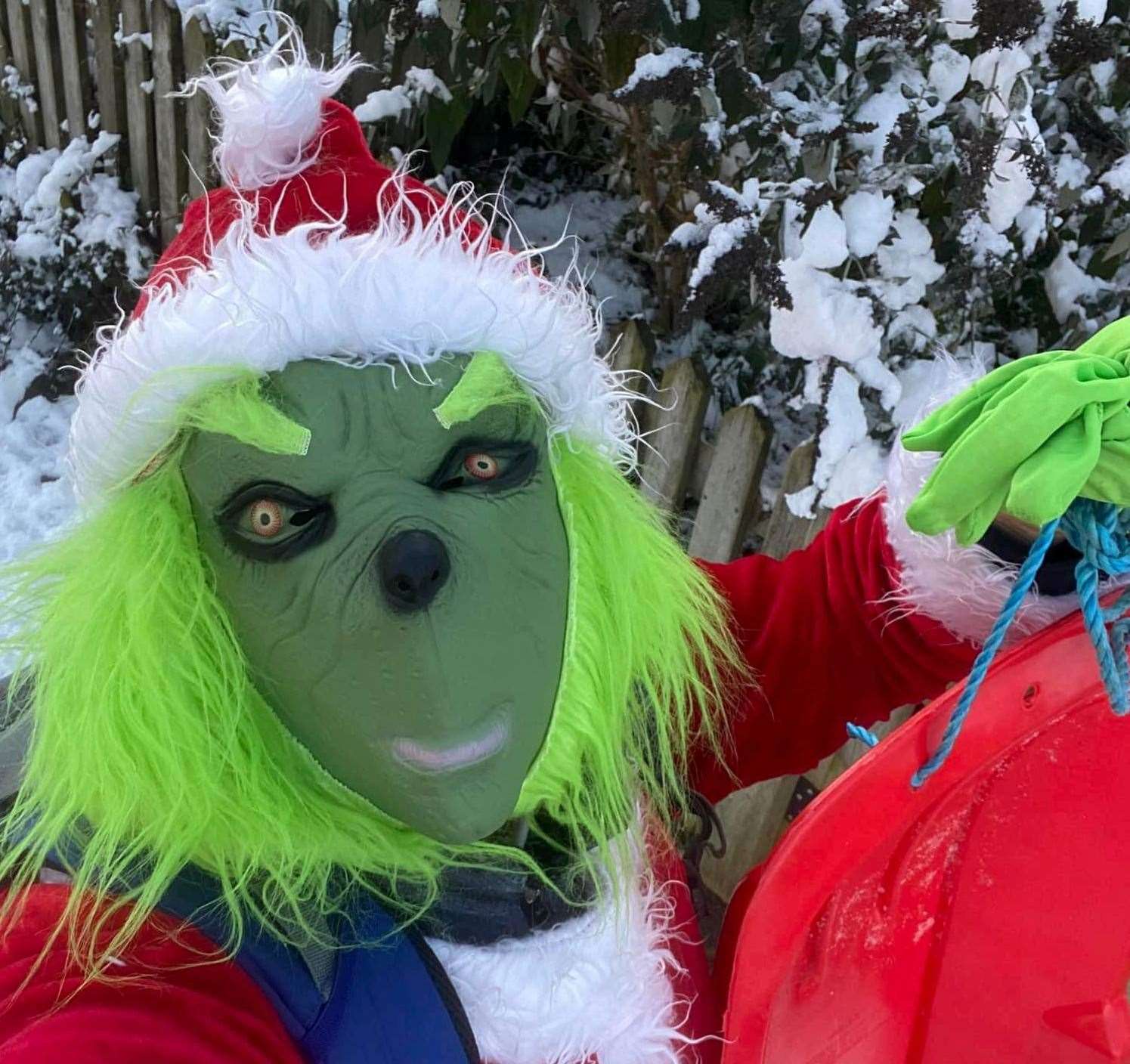 Daniel Wood dressed as the Grinch in 2022, to cheer up children on their way to school