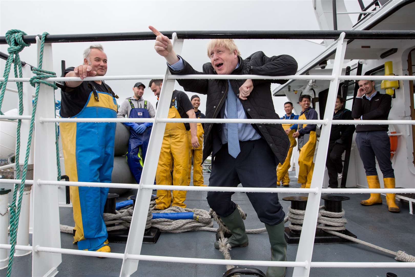 Prime Minister Boris Johnson speaks to members of the crew on the Carvela at Stromness Harbour (Robert Perry/PA)