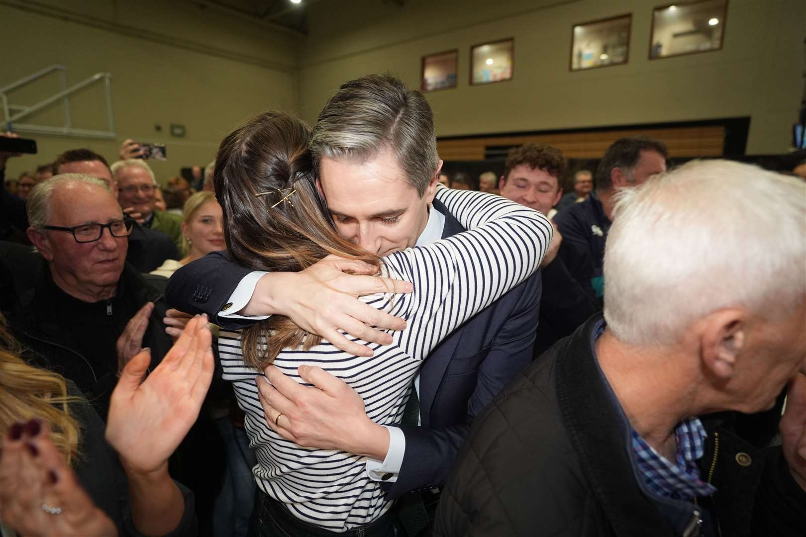 Simon Harris is hugged by his wife after being re-elected (Niall Carson/PA)