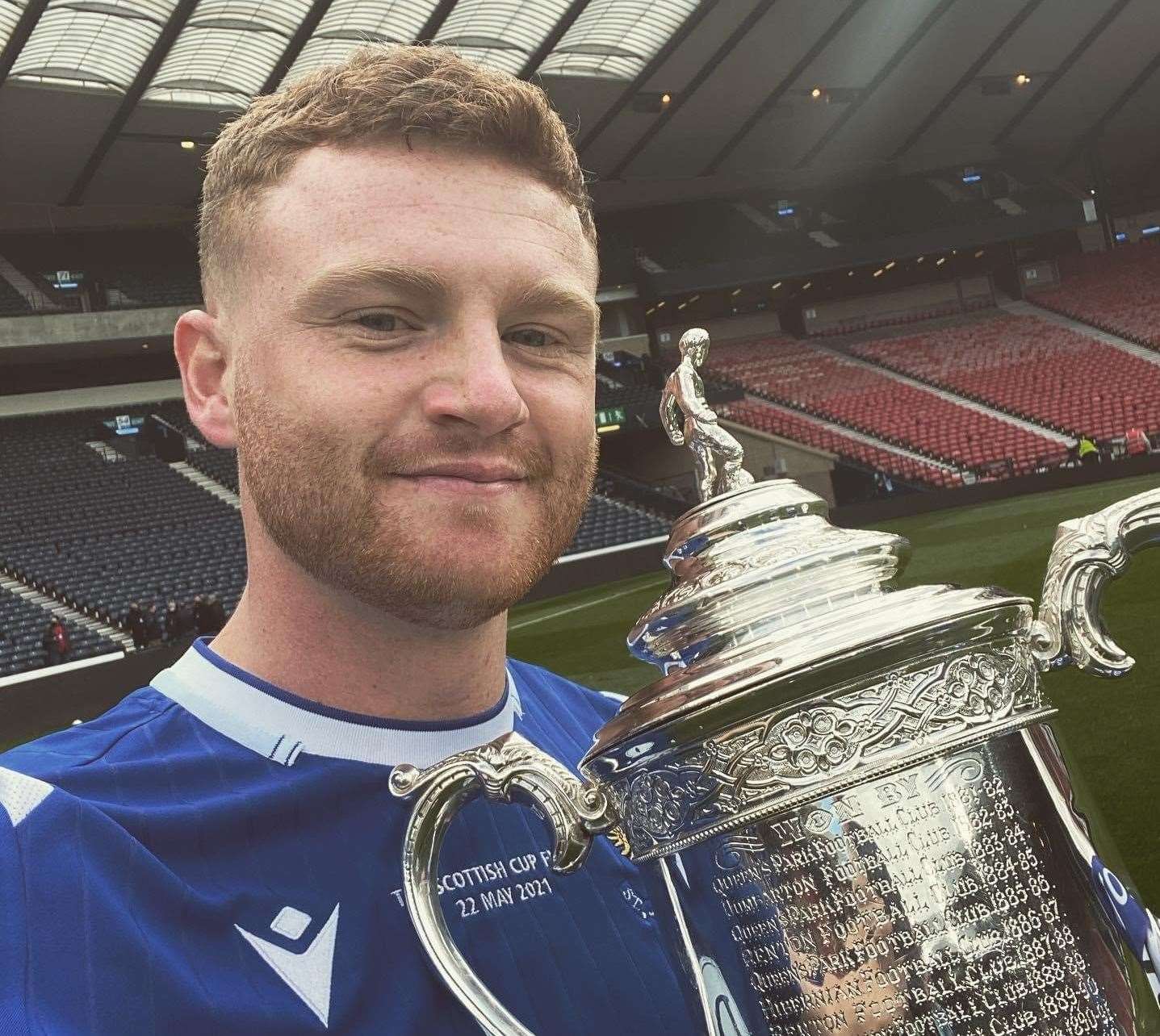 Dover's James Brown holds onto the Scottish FA Cup after St Johnstone beat Hibernian at Hampden Park Picture: Chris Brown
