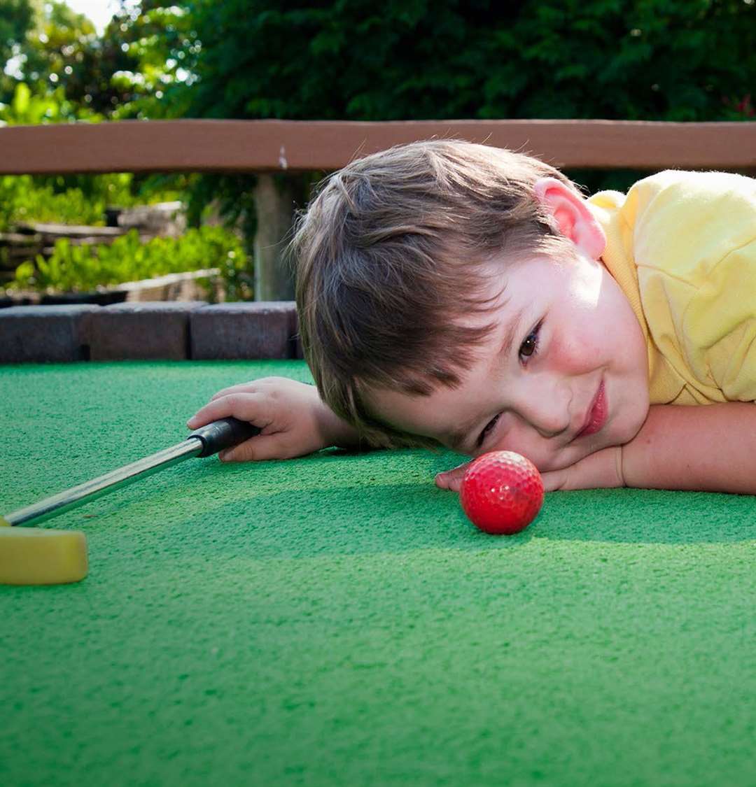 Children playing adventure golf