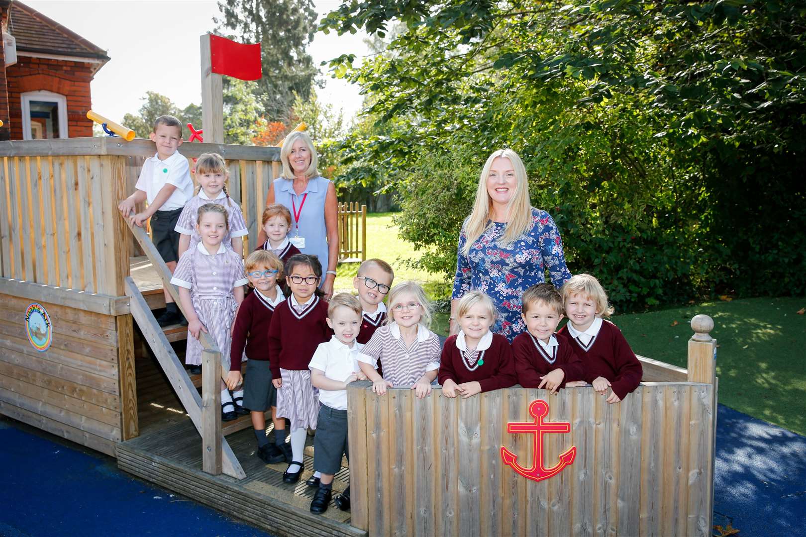 Pupils at the school in happier times with staff Julie Walton and Allison Ebanks