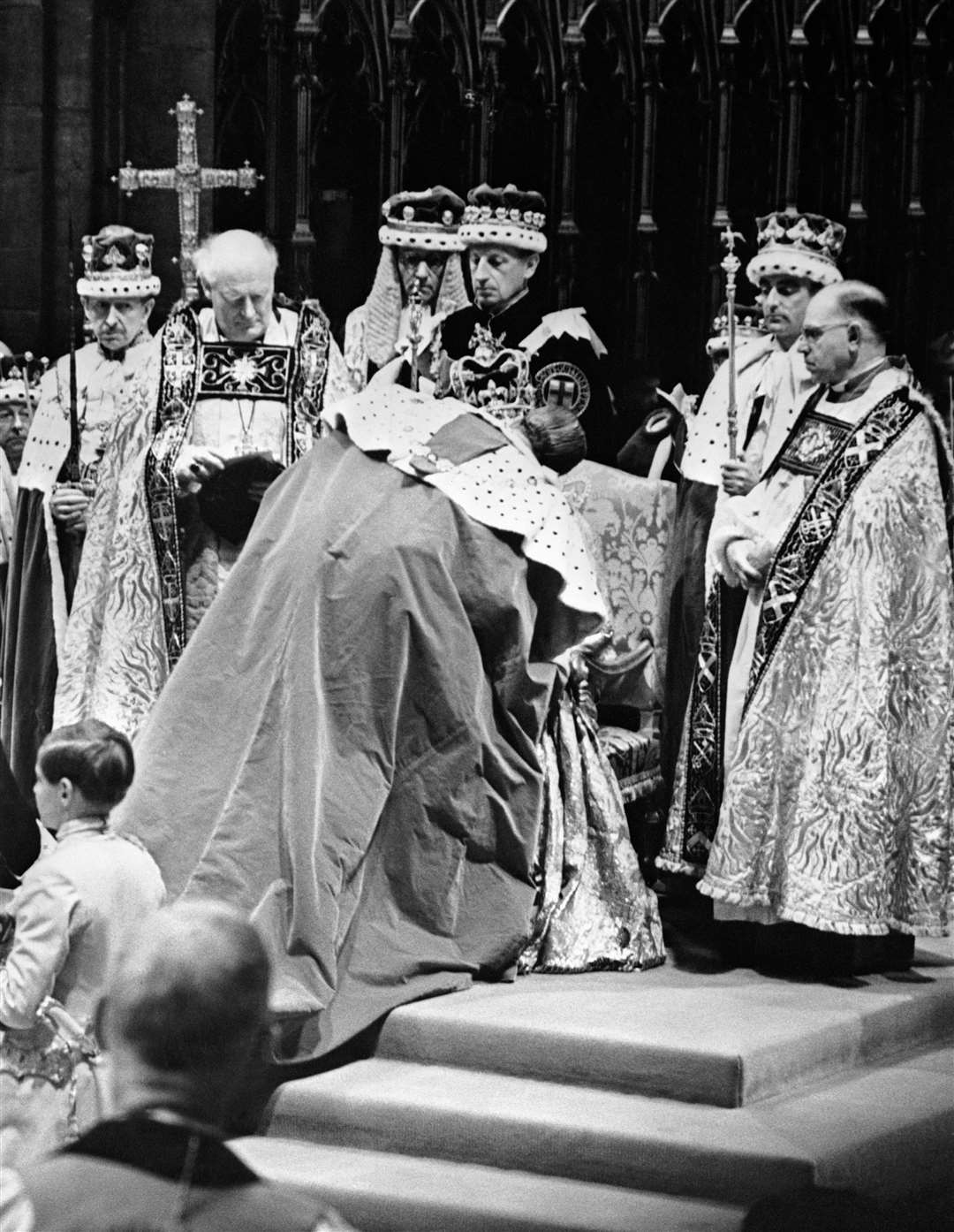 The Duke of Edinburgh paying homage to Elizabeth II during her coronation (PA)