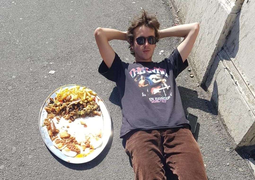 Mr Young laying next to the meal that bested him. Pic: Henry Young Twitter