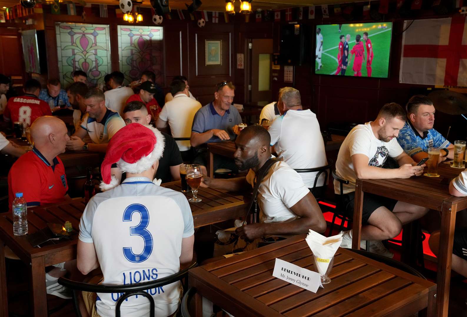 Fans gather at the Red Lion Pub & Restaurant in Doha (Jonathan Brady/PA)