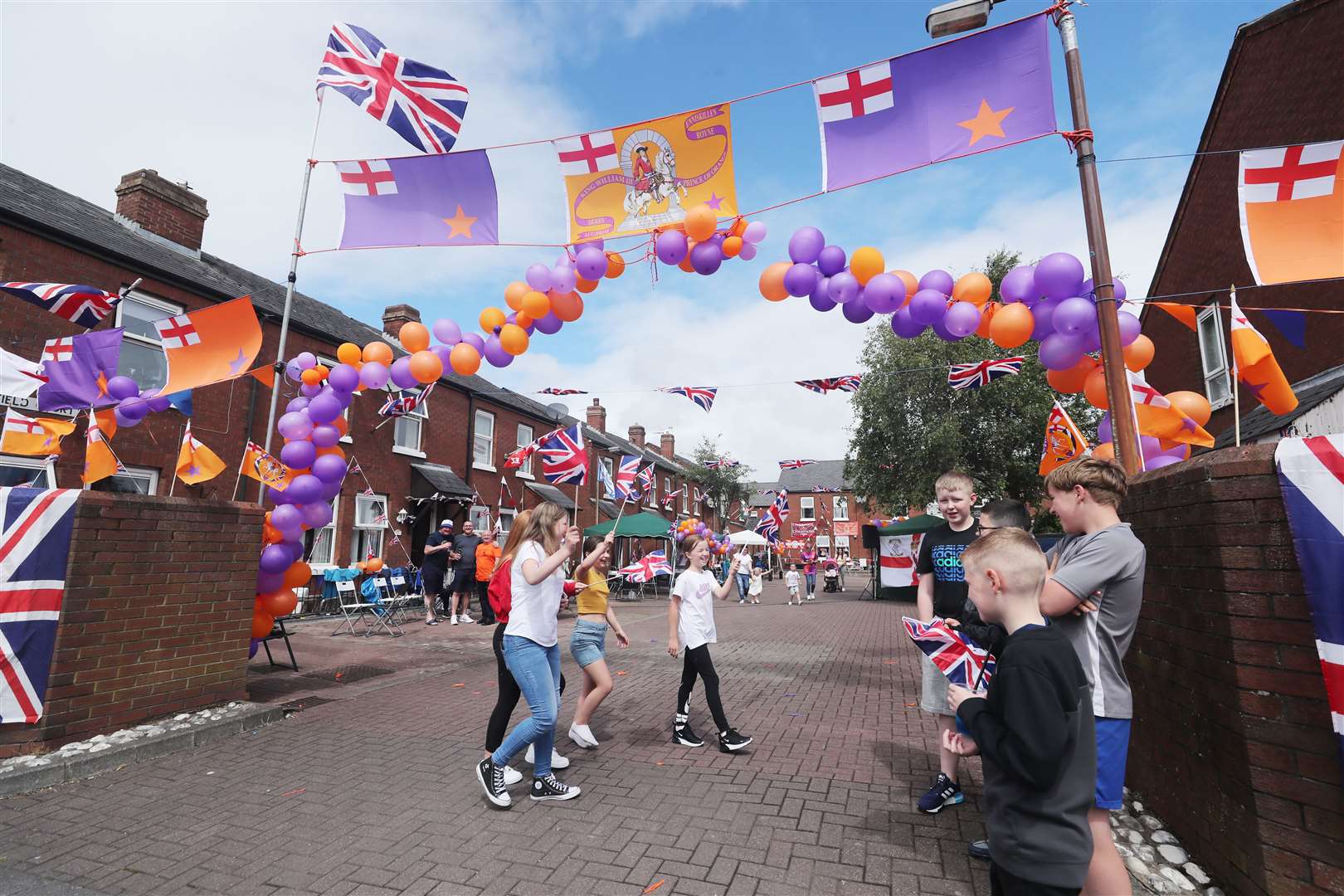 Children take part in a Twelfth street party in Beechfield Court (Niall Carson/PA)