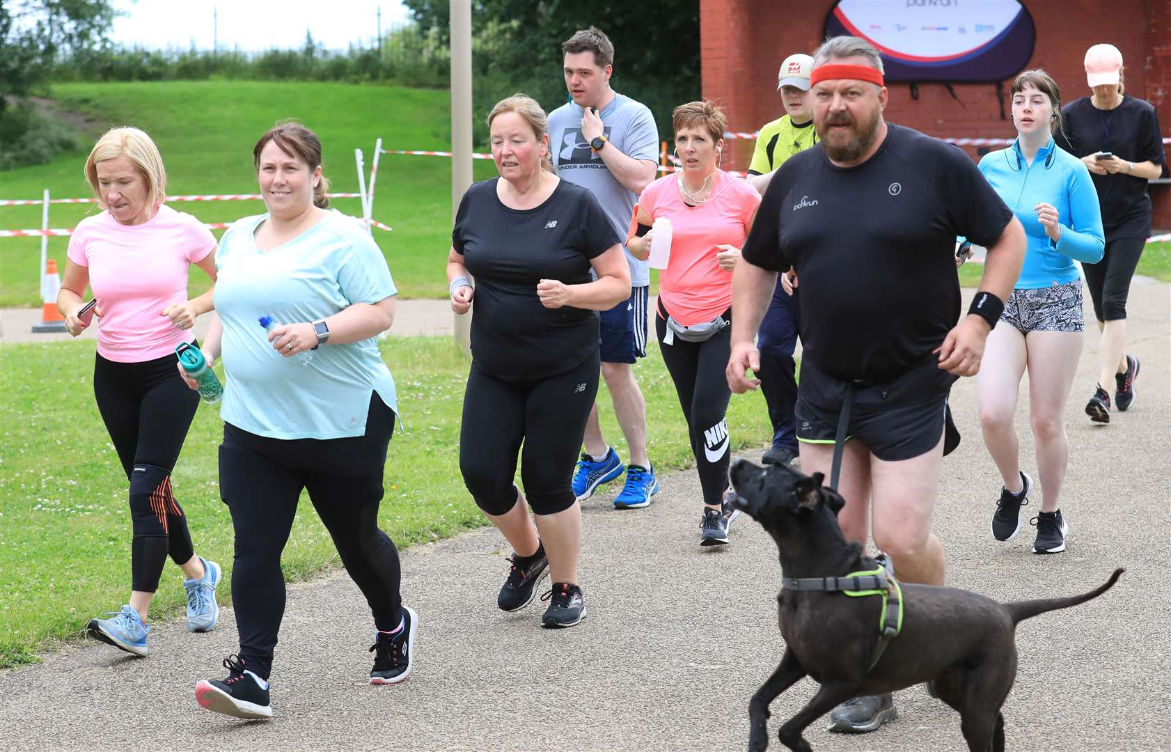 Runners with two legs and four enjoyed the return of parkrun events (Peter Morrison/PA)