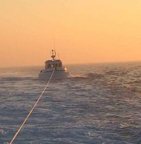 Casualty being towed by Dungeness RNLI lifeboat. Credit: RNLI/Trevor Bunney (7491595)