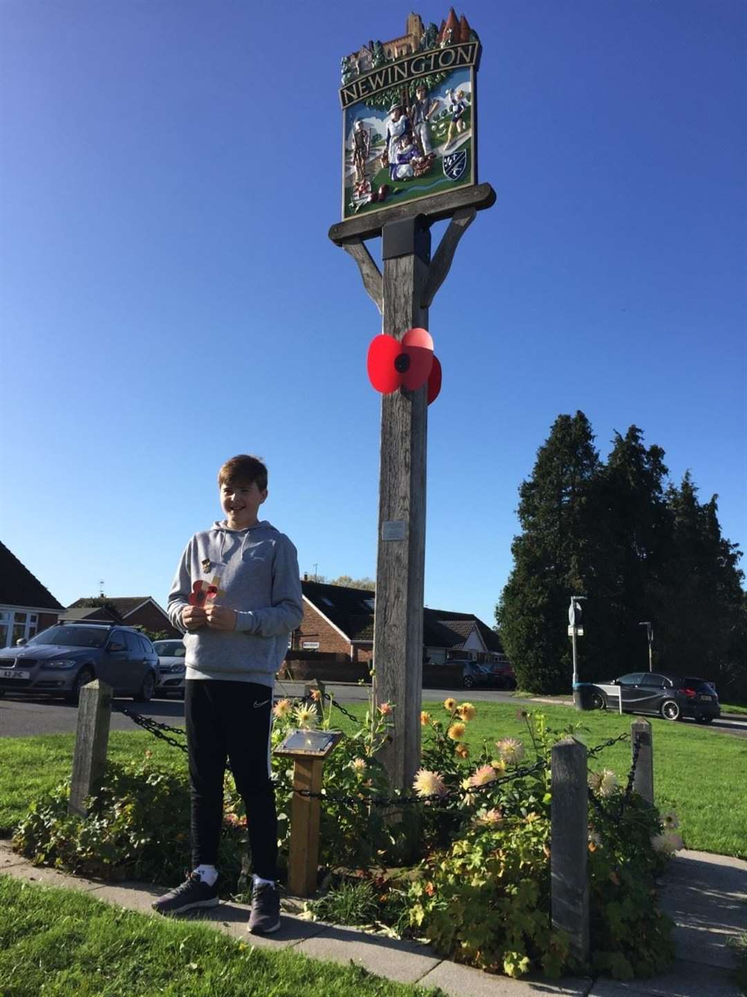 Daniel Colvin, 12, from Newington wearing miniatures of his great-grandfather Thomas McGregor’s First World War medals pays his tribute under the history group’s poppies at the Memorial Garden (20792695)