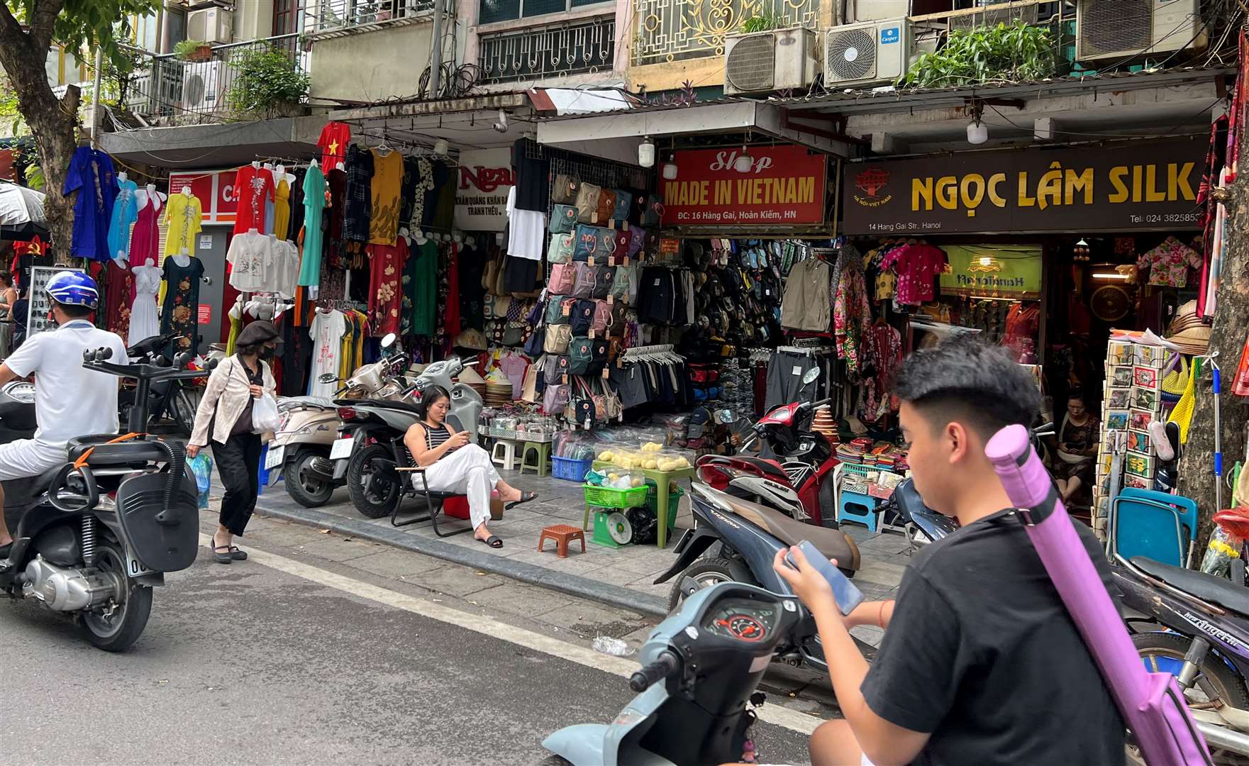 Note the moped rider, on his phone and with no helmet...it's a different world