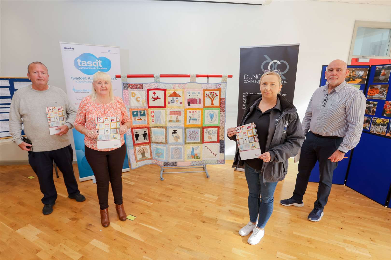 Harry Smyth (left) and Rab McCallum (right) with others in the DCP project team at the launch of Covid Quiltess (IFI/Press Eye/PA)