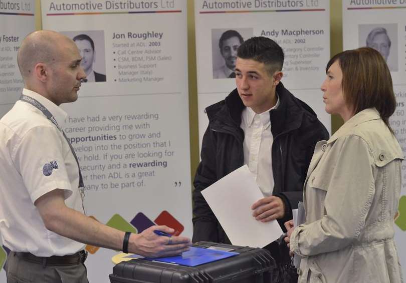 ADL recruitment event at the Hilton Maidstone. From left: Nathan Wise explains the jobs to Calum Long and his mum Trudy Fowler.
