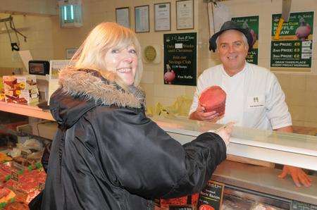JC Rook Butchers owner Ray Webb with customer Diane King.