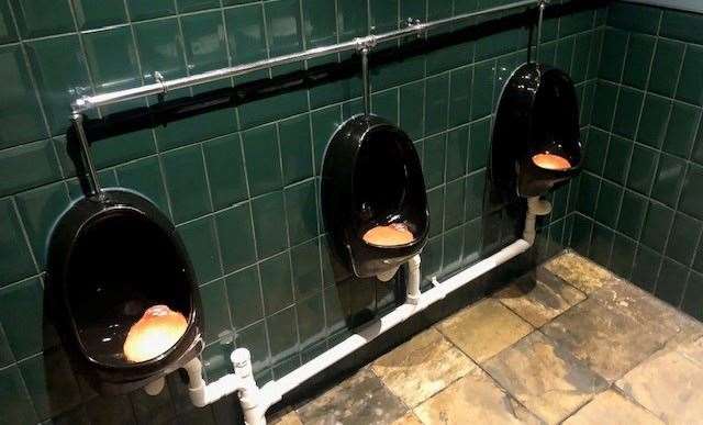 Tastefully decorated with dark green tiles on the walls and black urinals, the toilets were clean and fresh