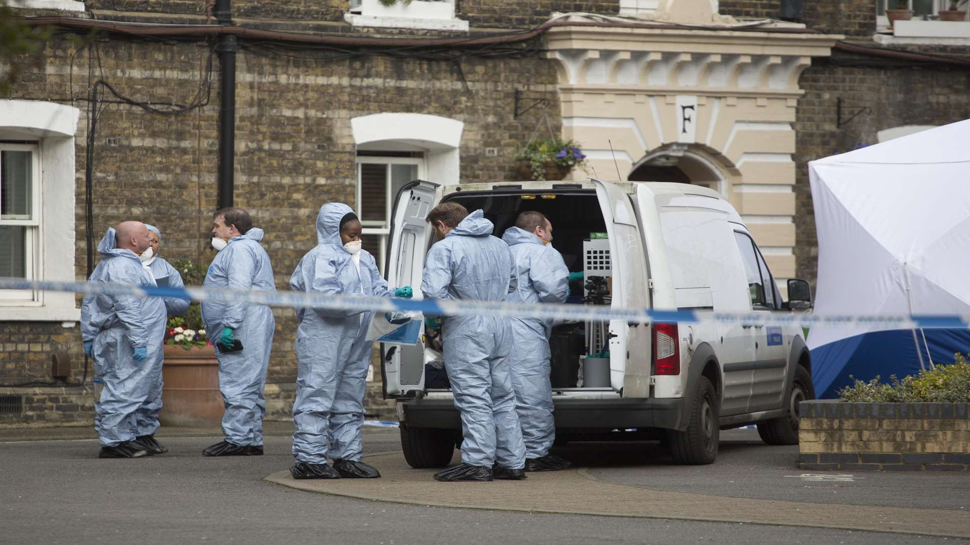 Police at the Southwark Estate where human remains were found 200ft from where missing PC Gordon Semple was last seen. Picture: SWNS