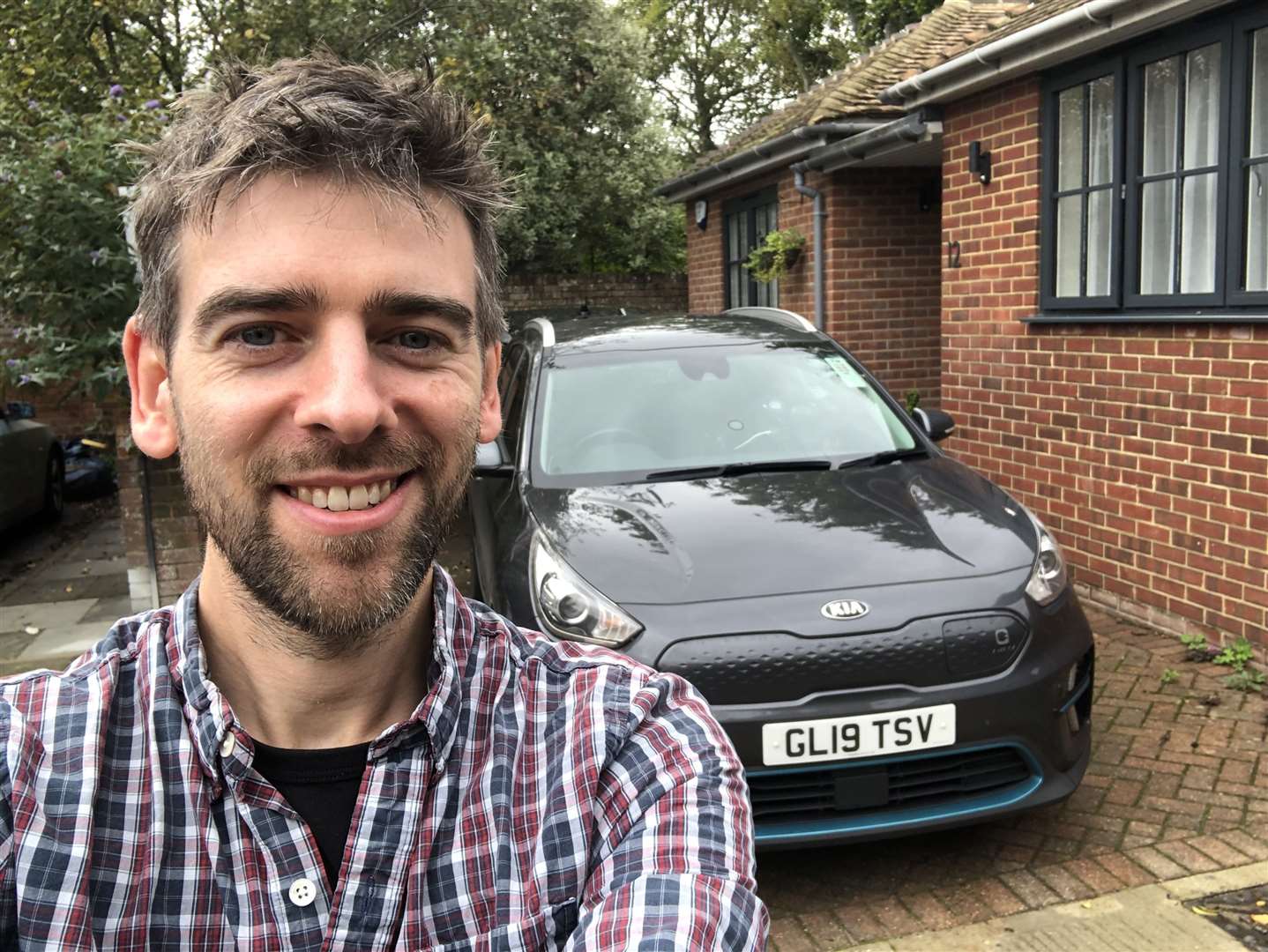 Andrew Till with his electric car