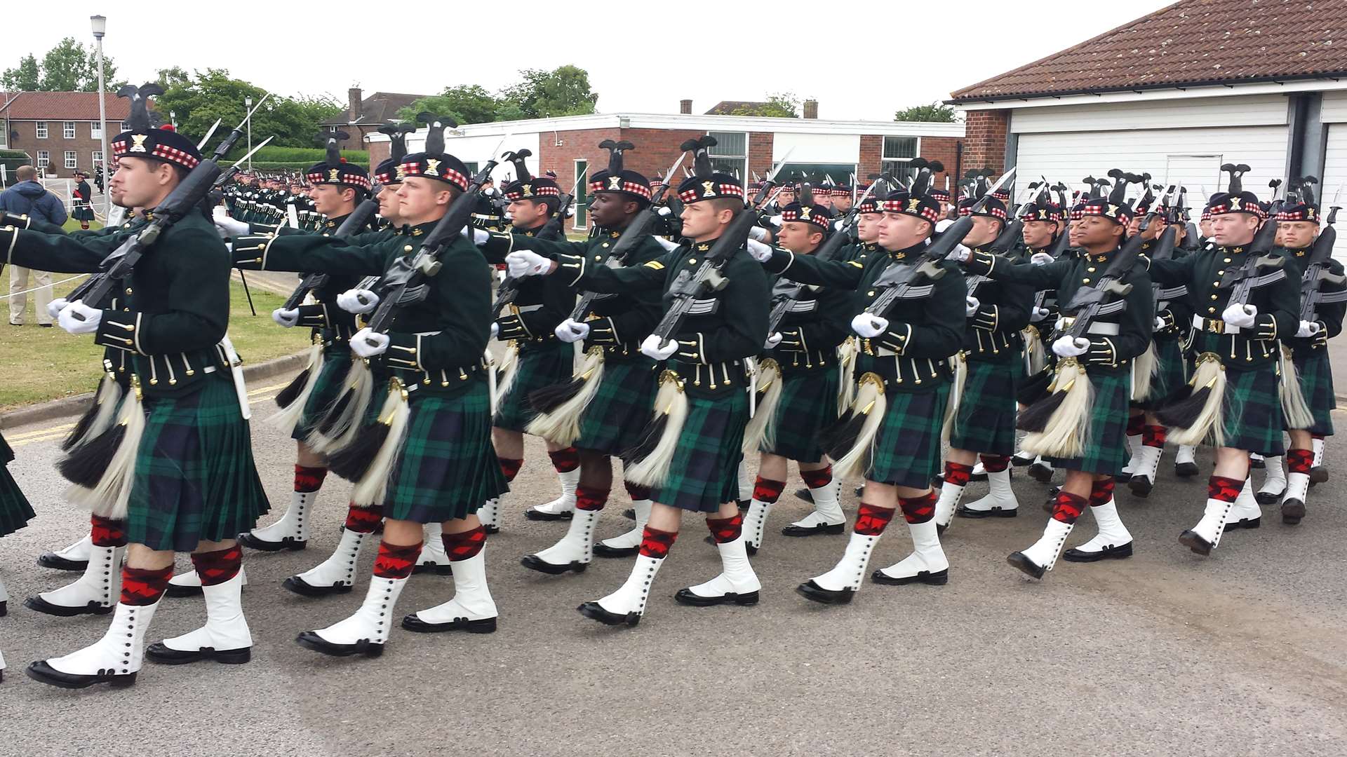 Soldiers march onto the parade square ahead of the Queen's imminent arrival