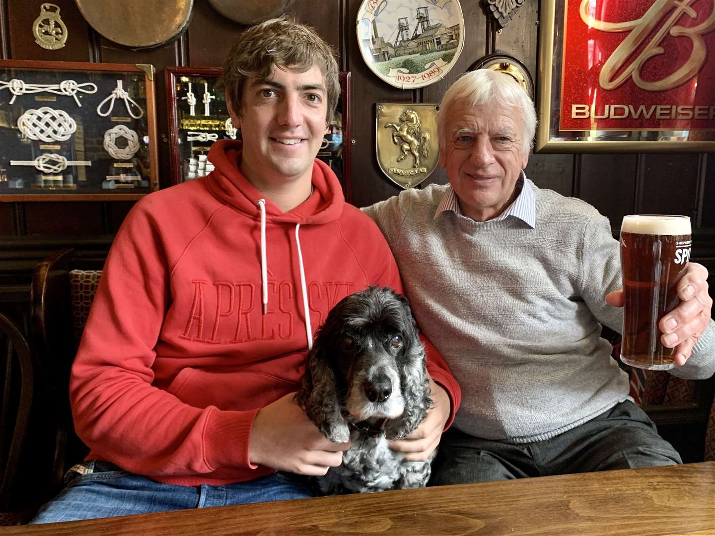 Father and son James and Graham Stiles with pub dog Charlie, pictured ahead of his 40th anniversary at The King's Head