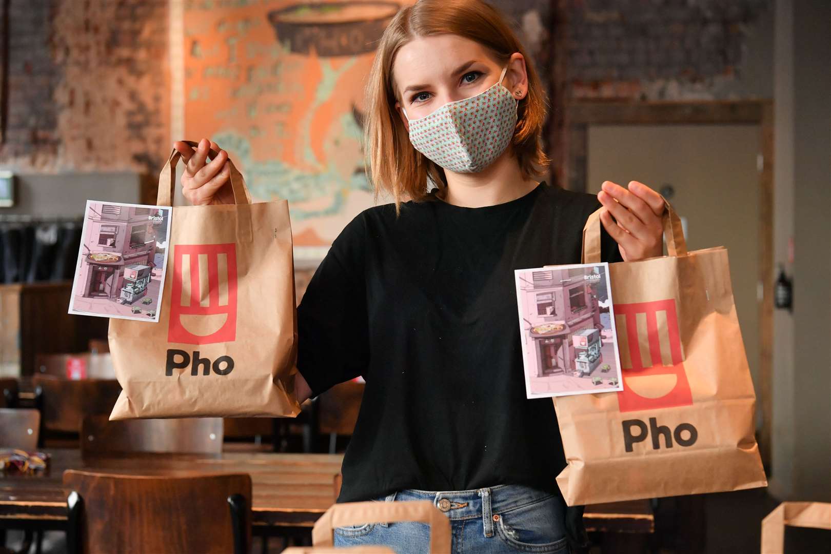 Staff member Dace Jurgenovska prepares free lunch bags for collection (Ben Birchall/PA)