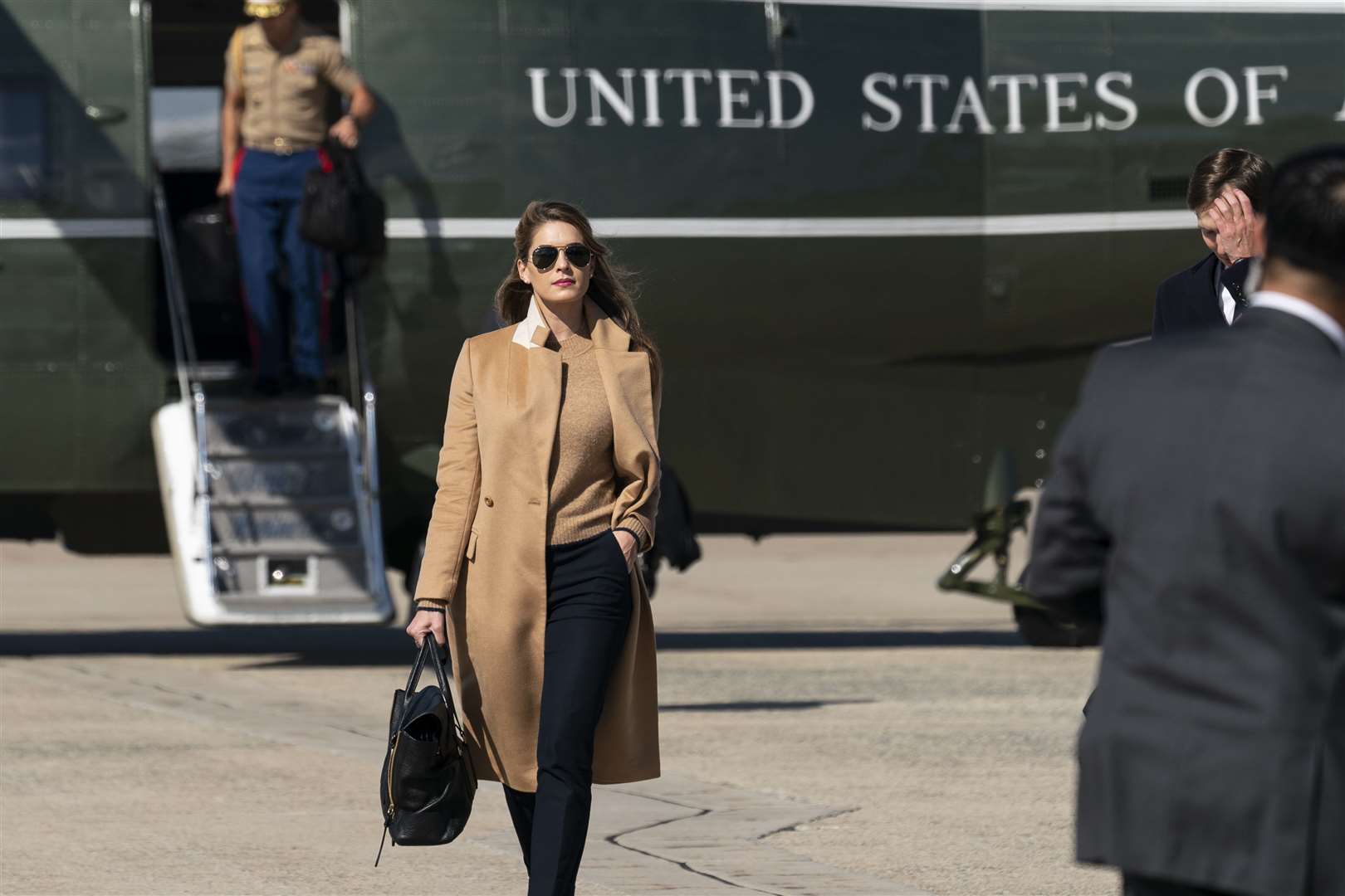 Hope Hicks walks from Marine One (Alex Brandon/AP)