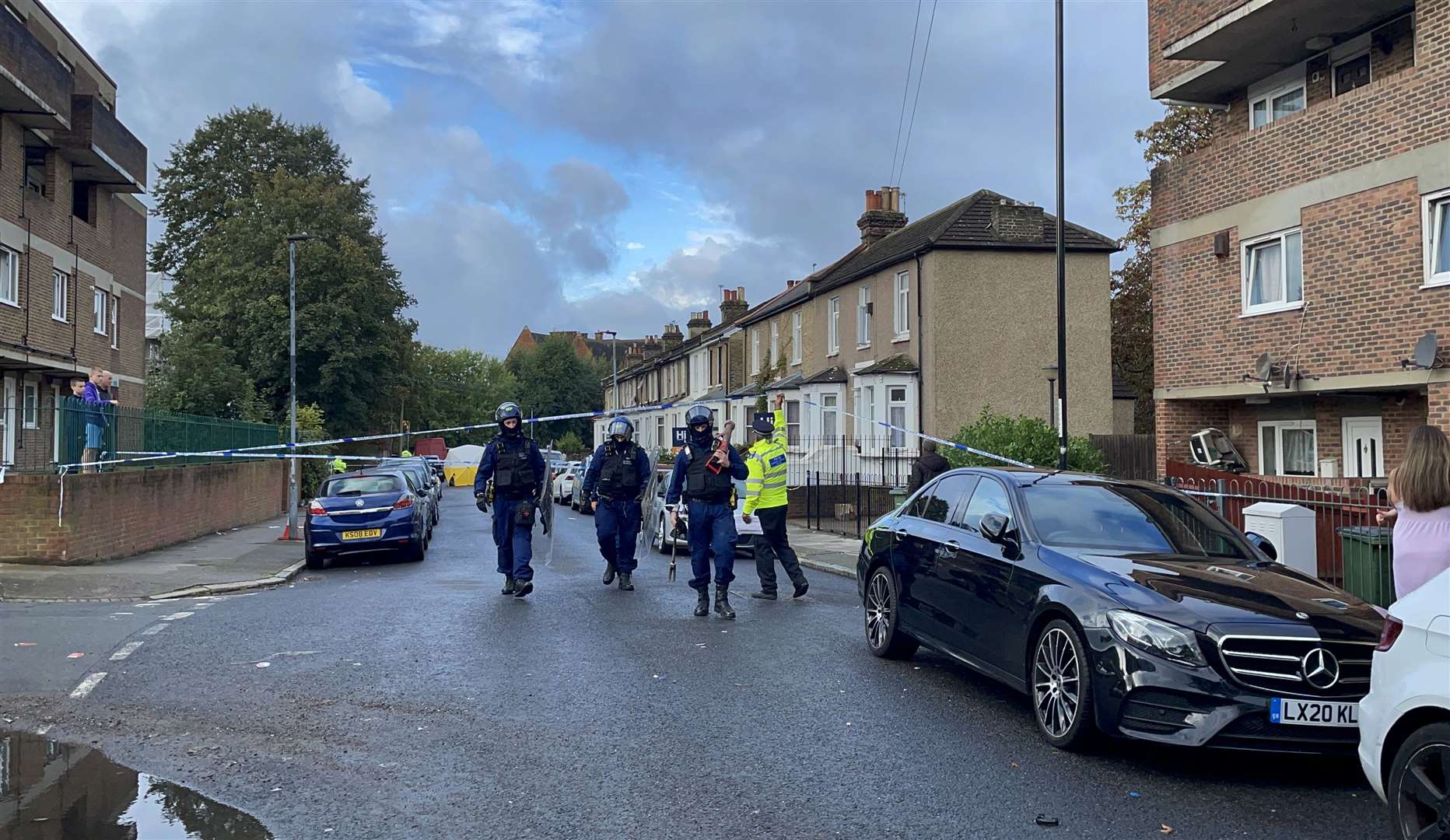 Officers at the scene in Eglinton Road, Woolwich, south-east London (Rosie Shead/PA)