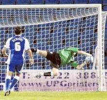 Alan Julian makes an acrobatic save from a free-kick