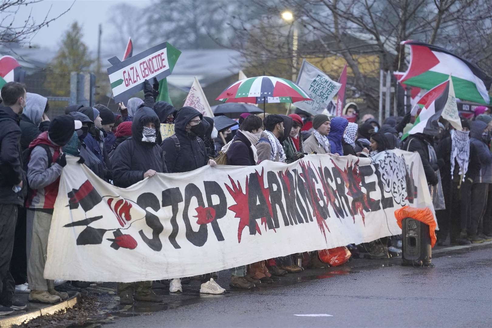 Protesters form a blockade outside Eaton Mission Systems in Wimborne near Bournemouth (Andrew Matthews/PA)