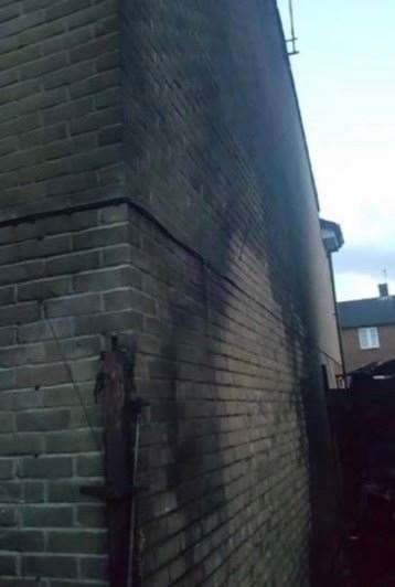 The brick work in the house next door was left covered in ash.