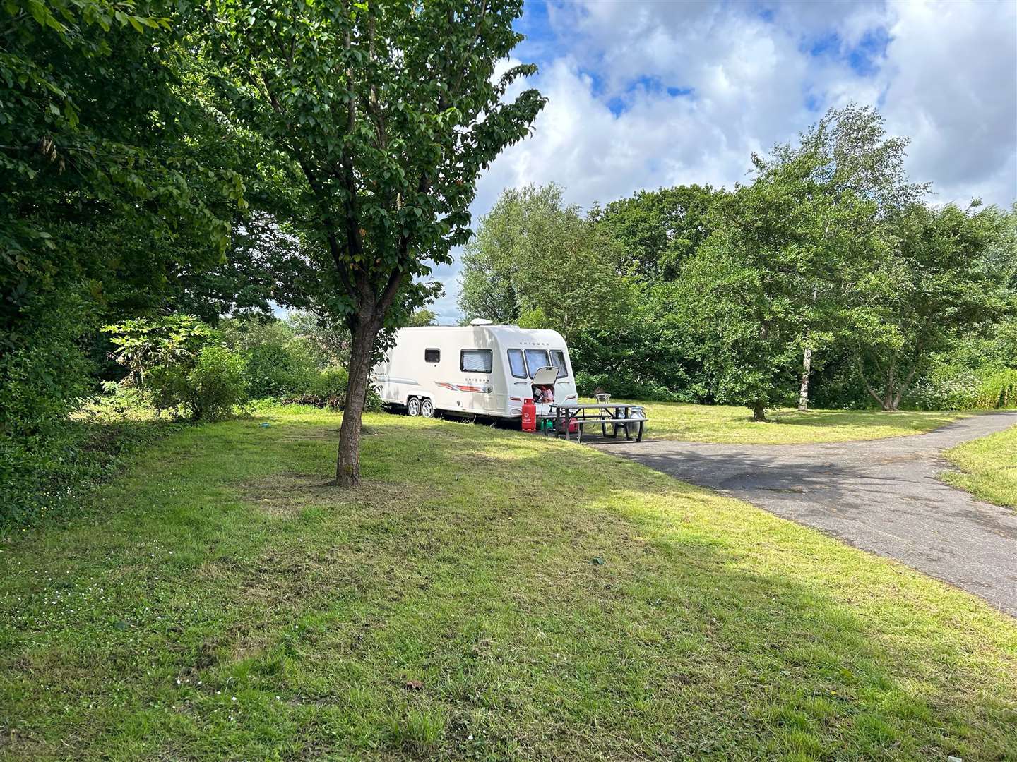 A caravan behind the Kingsnorth Recreation Centre