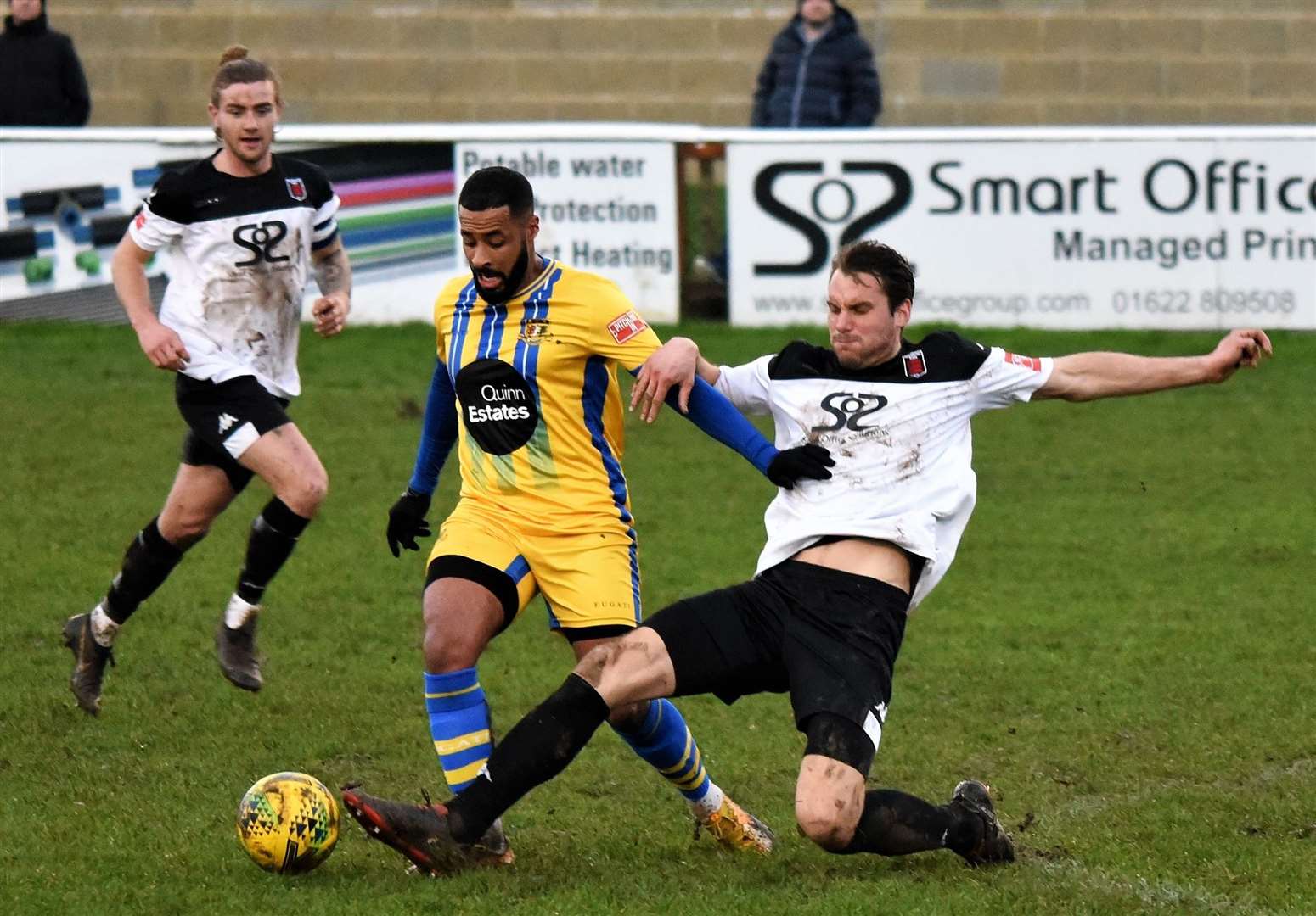 Jono Richardson slides in for Faversham during their 3-1 success over Sittingbourne on Monday. Picture: Ken Medwyn