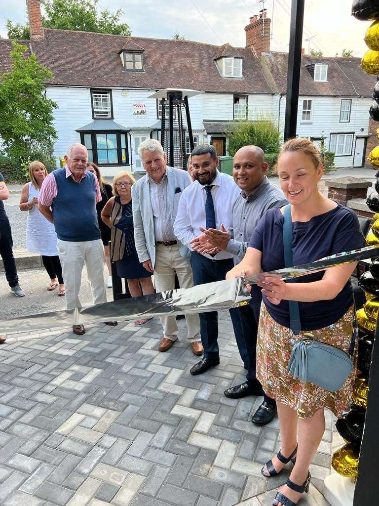 Owner Tariq Ahmed, second right, and his brother Jamil, third right, outside Bleú Steakhouse in Staplehurst High Street