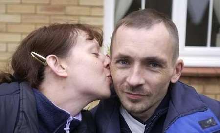 PROUD: Michael Gough receives a kiss from wife Jacqueline. Picture: GAVIN CRAYFORD