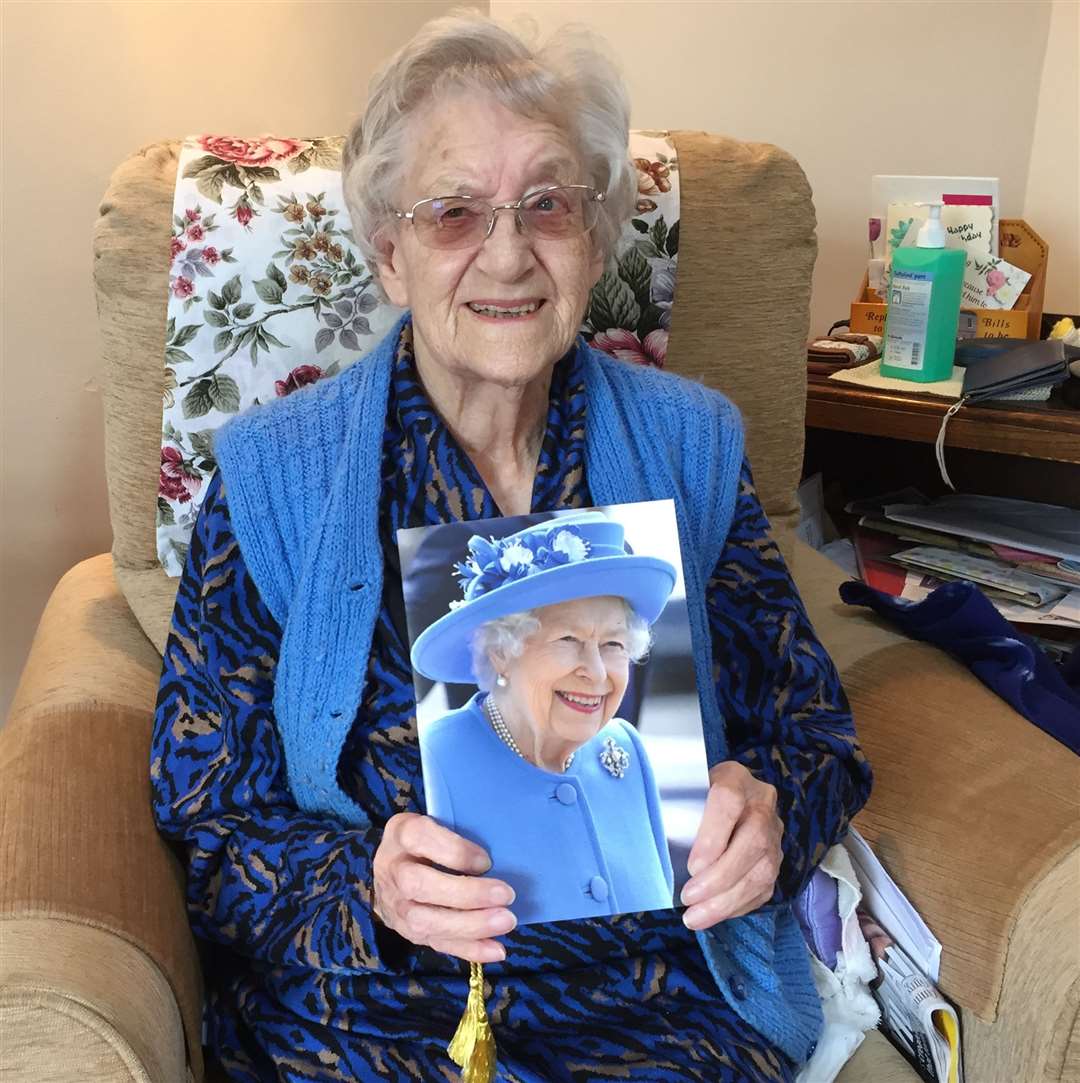 Yvonne Burgess with her card from The Queen