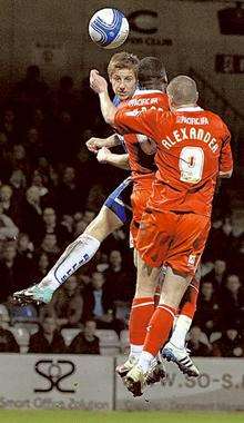 Connor Essam heads the ball towards goal