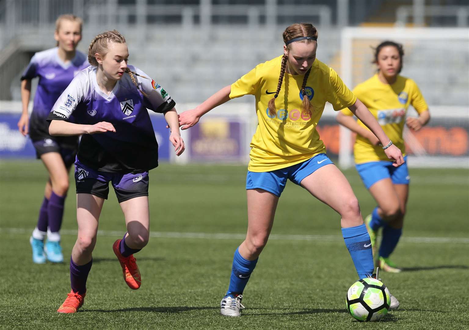 Kings Hill (yellow) on the ball in the Kent Merit Under-15 girls cup final. Picture: PSP Images (55851396)