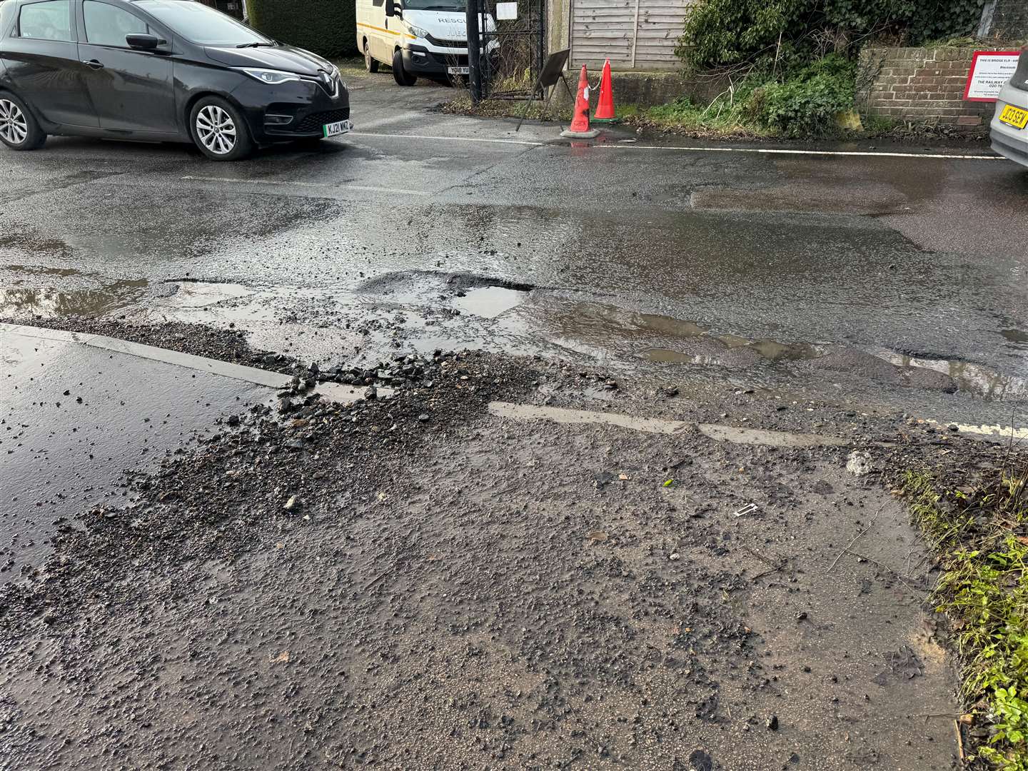 Crater-like potholes force cars to drive in the middle of the narrow carriageway at Blacksole Bridge, Herne Bay