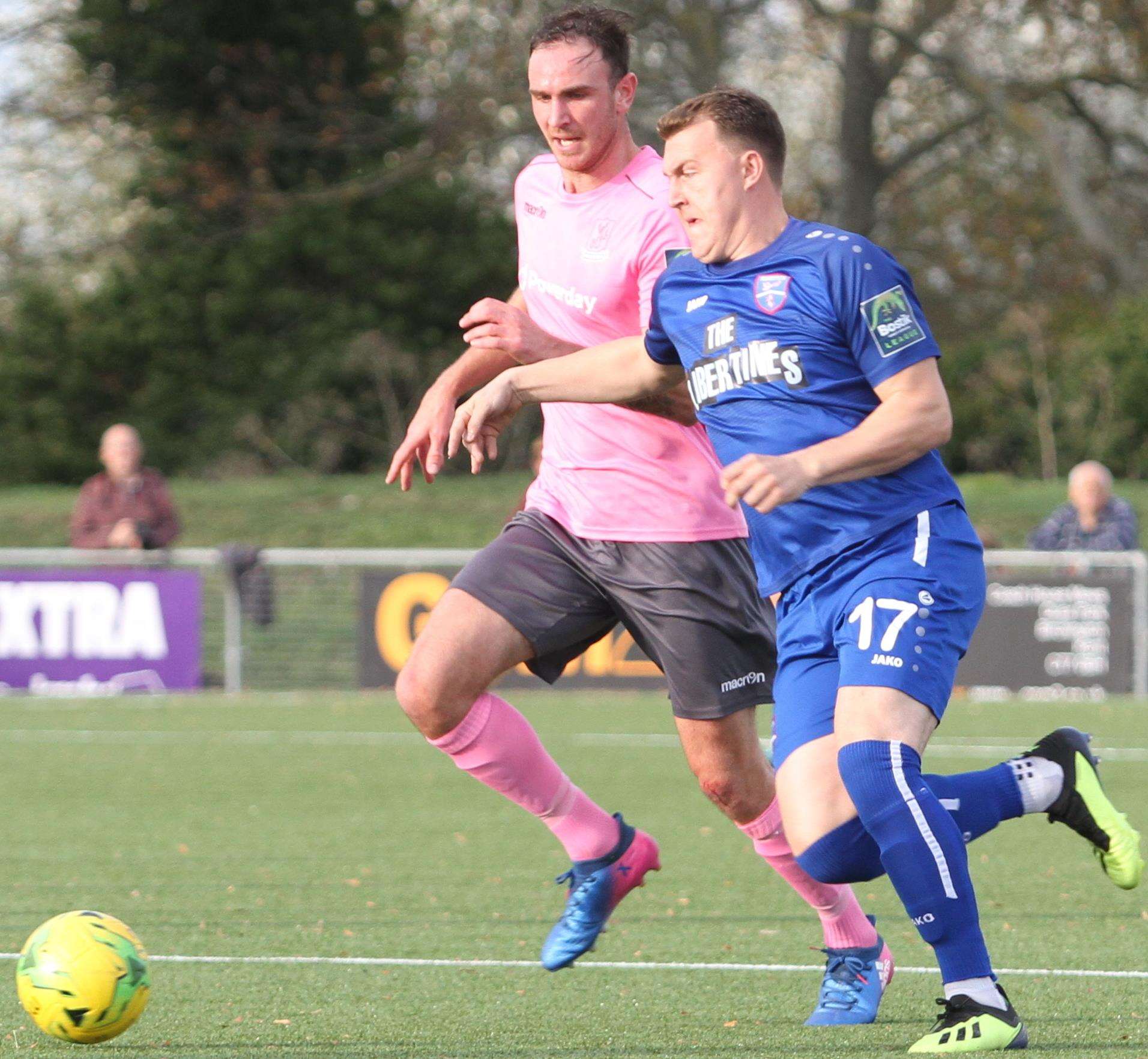 Alex Flisher takes on Enfield's ex-Margate midfielder Matt Johnson on Saturday Picture: Don Walker