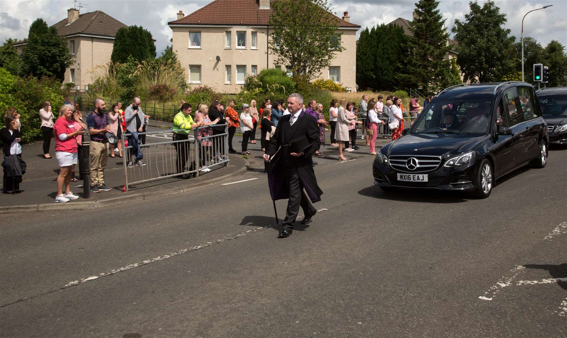 Friends and local residents lined the streets to pay their respects (Robert Perry/PA)