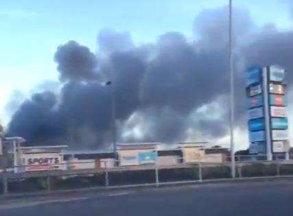 The huge plume of smoke can be seen from miles away. Picture: David Gravener